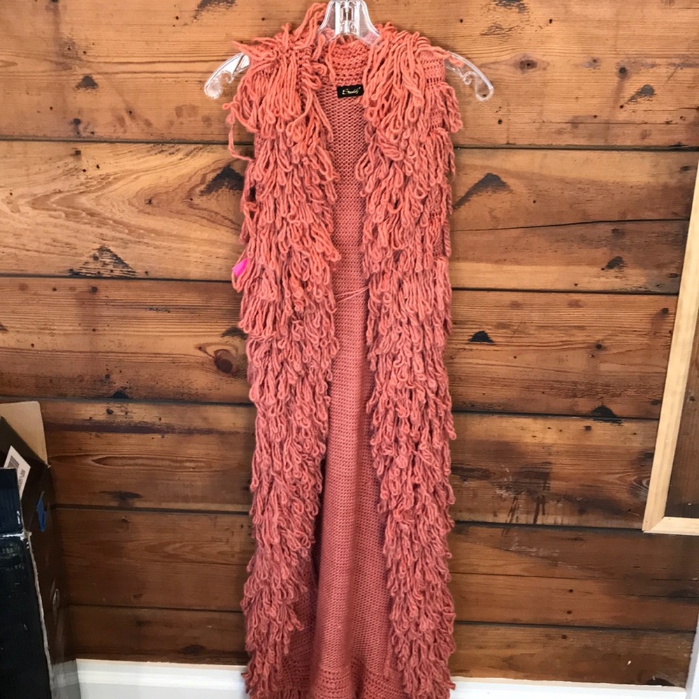 Woman’s pink sleeveless sweater dress